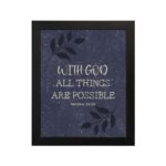 Purple-blue background with black leaf design, white text 'With God All Things Are Possible Matthew 19:26 Bible Verse Wall Art black frame hung on the wall.