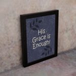 Christian wall art with In God I Have Put My Trust I Will Not Fear Psalm 56:4 on a purple-blue background with a leaf design black frame on the wall