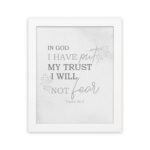 Christian wall art featuring Psalm 56:4 Bible verse on a gray background with gray leaf design and black and gray font white frame hung on the wall.