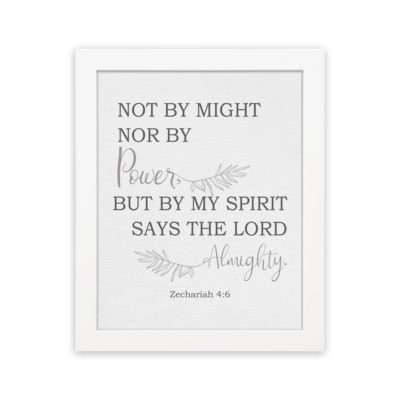 Christian wall art featuring Zechariah 4:6 Bible verse on a gray background with gray leaf design and black and gray font and white frame hung on the wall.