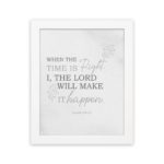 Christian wall art featuring Isaiah 60:22 Bible verse on a gray background with gray leaf design and black and gray font white frame hung on the wall.