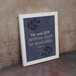 Christian wall art with purple-blue background, black leaf design, and white text For With God Nothing Shall Be Impossible Luke 1:37 Bible Verse Wall Art white frame on the wall