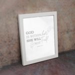 Christian wall art featuring the verse God Is Within Her; She Will Not Fall from Psalm 46:5 on a gray background with a gray leaf design and black and gray font white frame on the wall.