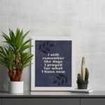 Infidu, I still remember the days I prayed for what I have now. Bible Verse wall art with a purple-blue background, black leaf design, and white font is perfect for home office decor and white frames on the table.