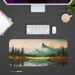 Desk pad featuring a serene landscape of mountains, pine trees, and a calm lake with a soft blue and green color palette. Design Kept on a computer table