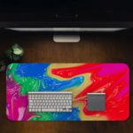 Infidu Artistic Desk Pad with swirling, marbled pattern in vibrant colors of red, blue, purple, green, and yellow. Desk Pad in computer table