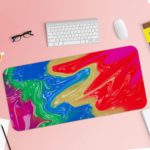 Infidu Artistic Desk Pad with swirling, marbled pattern in vibrant colors of red, blue, purple, green, and yellow. Desk Pad with Keyboard and Mouse