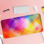 Infidu Geometric Patterns Desk Pad with overlapping transparent diamond shapes in multi-colored gradients. Desk Pad with Keyboard and Mouse