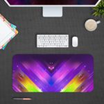 Desk mat with vibrant, colorful geometric patterns in purple, blue, pink, and yellow, resembling cosmic lighting effects. Design Kept on a computer table