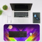 Desk mat with vibrant, colorful geometric patterns in purple, blue, pink, and yellow, resembling cosmic lighting effects. Desk Mat with an Apple Laptop