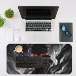 An anime-style character with dark hair and a red headband surrounded by shadowy forms creates a mysterious atmosphere. Desk Mat with an Apple Laptop