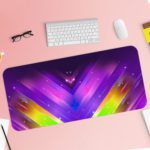 Desk mat with vibrant, colorful geometric patterns in purple, blue, pink, and yellow, resembling cosmic lighting effects. Desk Pad with Keyboard and Mouse