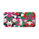 Colorful abstract desk pad with playful patterns, featuring pink, green, red, black, and white shapes resembling flowers and circles. Desk Pad kept on a plain white background