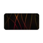 Golden curved lines crisscrossing on a black background, create a dynamic and elegant abstract design. Desk Pad kept on a plain white background