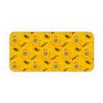 Desk pad with a bright yellow background featuring black curved lines and blue circular shapes. Desk Pad kept on a plain white background