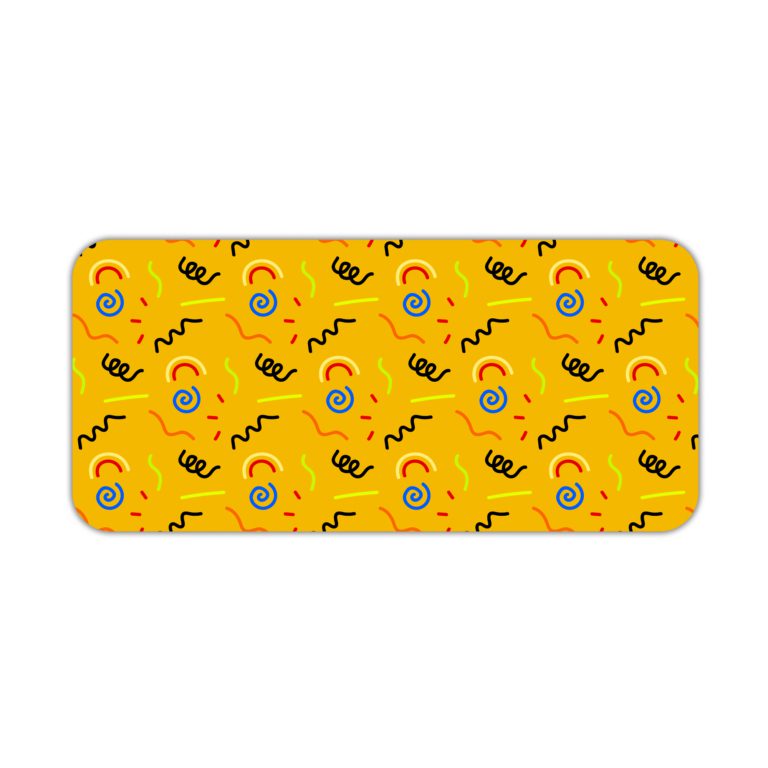 Desk pad with a bright yellow background featuring black curved lines and blue circular shapes. Desk Pad kept on a plain white background