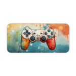 Gaming Desk Pad featuring a blue and orange controller with a blue and yellow right side, set against a vibrant background of blue, orange, and yellow paint splashes. Desk Pad kept on a plain white background