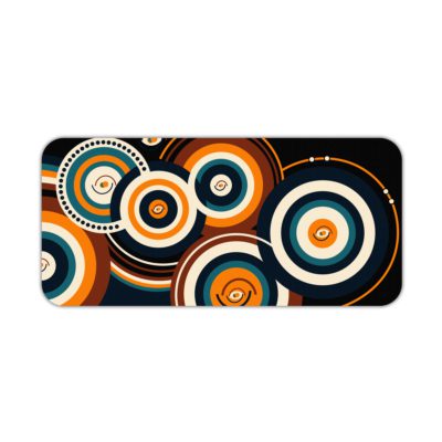 Infidu Artistic Desk Mat with concentric orange and white circular patterns on a dark blue or black background. Desk Pad kept on a plain white background