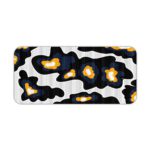 Infidu Artistic Patterns Desk Pad with a black background and large, irregular white and orange abstract shapes. Desk Pad kept on a plain white background