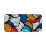 Infidu Desk Pad with colorful wave patterns in orange, blue, white, and red. Desk Pad kept on a plain white background