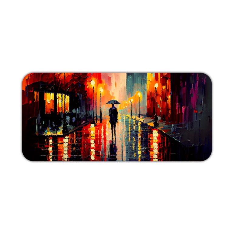 Desk pad featuring a vibrant nighttime city scene with bright colors reflecting off wet streets. Silhouette of a person with an umbrella in the center. Desk Pad kept on a plain white background