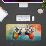 Gaming Desk Pad featuring a blue and orange controller with a blue and yellow right side, set against a vibrant background of blue, orange, and yellow paint splashes. Desk Pad with Antique Video Game Design Kept gray background