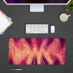 Infidu Artistic Animated Desk Pad with a swirling marbled pattern in pink, white, and red. Desk Pad with Design Kept on a computer table