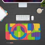 Infidu Artistic Patterns Desk Pad with colorful geometric shapes in pink, green, yellow, blue, and purple. Desk Pad with Design Kept on a computer table