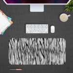 Infidu Artistic Patterns Desk Pad with vertical black and white lines creating a dense, forest-like pattern and optical illusion effect. Desk Pad with Design Kept on a computer table