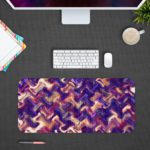 Infidu Artistic Patterns Desk Pad with a purple and pink wavy pattern, accented with white and dark red zigzag lines. Desk Pad with Design Kept on a computer table