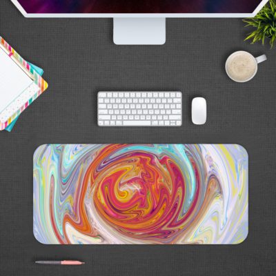 Abstract swirl pattern with vibrant red, yellow, purple, and blue colors on a light blue and white background. Design Kept on a computer table