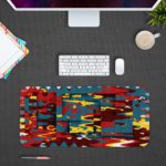 Infidu Artistic Patterns Desk Pad features a colorful abstract design with blue, red, yellow, and black layered shapes and lines. desk pad designed to be kept on a computer table