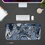 Infidu Artistic Patterns Desk Pad - Abstract Art Collection with marbled texture in blue, white, and black Design Kept on a computer table