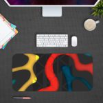 Infidu Artistic Desk Mat with bold curvy shapes in yellow, red, and blue on a dark black background. Desk Mat Design Kept on a computer table