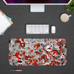 Red and gray desk pad with swirling, energetic shapes and doodle art. Desk Pad in computer table