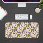 The cute panda desk mat has adorable panda faces and green leaves on a white and sandal background. Desk Pad in computer table