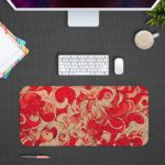 Infidu Artistic Patterns Desk Pad - Red Color with swirling vector doodle art. Design Kept on a computer table