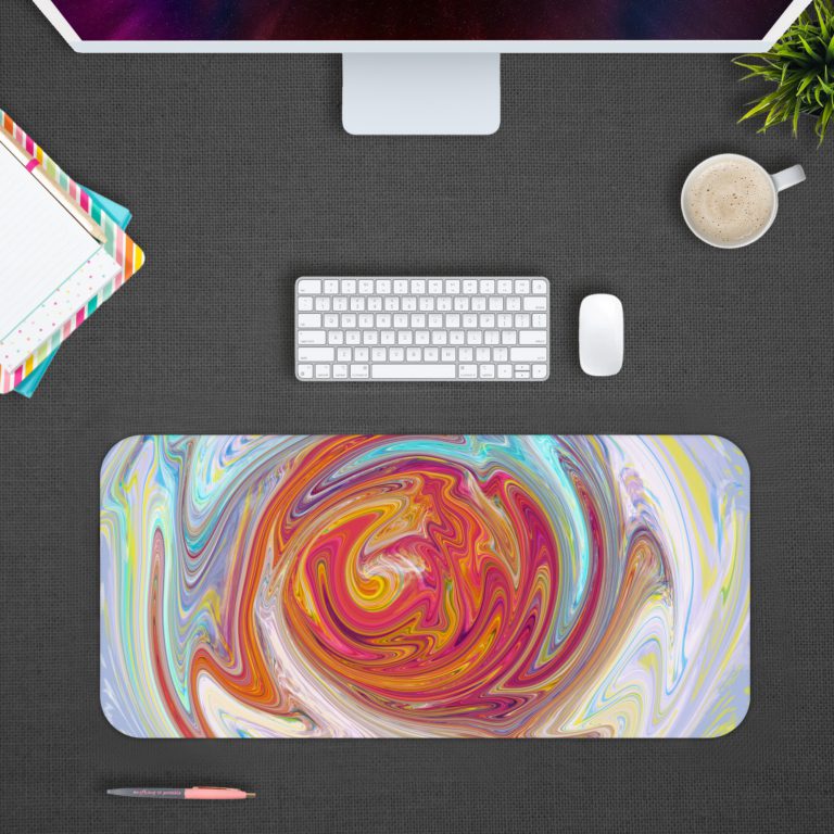 Abstract swirl pattern with vibrant red, yellow, purple, and blue colors on a light blue and white background. Design Kept on a computer table