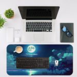 Serene nighttime scene with a full moon reflected in calm waters and tree silhouettes on the Infidu Nature Inspired Desk Mat. Desk Mat with an Apple Laptop