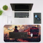 A Boy standing by train tracks with a red train and sunset in the background on the Infidu Artistic Desk Pad. Desk Mat with an Apple Laptop