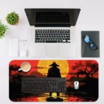 Ninja samurai standing in water with a warm sunset backdrop on the Infidu Creative Workspace Desk Pad. Desk Mat with an Apple Laptop