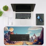 Fantastical landscape with towering, colorful rock formations in vibrant blues, purples, and oranges. Desk Mat with an Apple Laptop