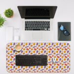 Desk pad with orange and yellow spots on a white background, featuring a playful and lively design. Desk Mat with a laptop