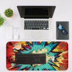 Infidu Color Wave Boom Desk Pad with a bright sun and colorful rocky background in red, blue, yellow, and white. Desk Mat with a laptop