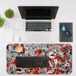 Red and gray desk pad with swirling, energetic shapes and doodle art. Desk Mat with in laptop