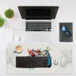 Gaming Desk Pad featuring a multi-colored controller on a mainly white background, designed for a unique and artistic look Desk Mat with an Apple Computer