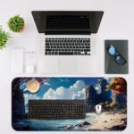 Desk pad showing a serene beach with blue water, towering rocks, white clouds, and trees with reddish leaves. Desk Mat with an Apple Laptop