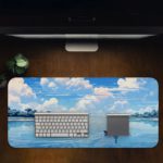 Man rowing a boat on calm water with a bright blue sky and fluffy white clouds reflecting below. Desk Pad in computer table