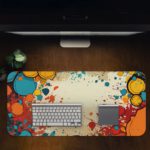 Infidu Color Splash Animated Desk Pad featuring a bubble-like pattern with red, blue, and orange colors on an abstract, marbled background. Desk Pad on the computer table