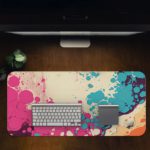 Infidu Color Splash Animated Desk Pad featuring a bubble-like pattern with pink, blue, and orange colors on an abstract, marbled background. Desk Pad on the computer table